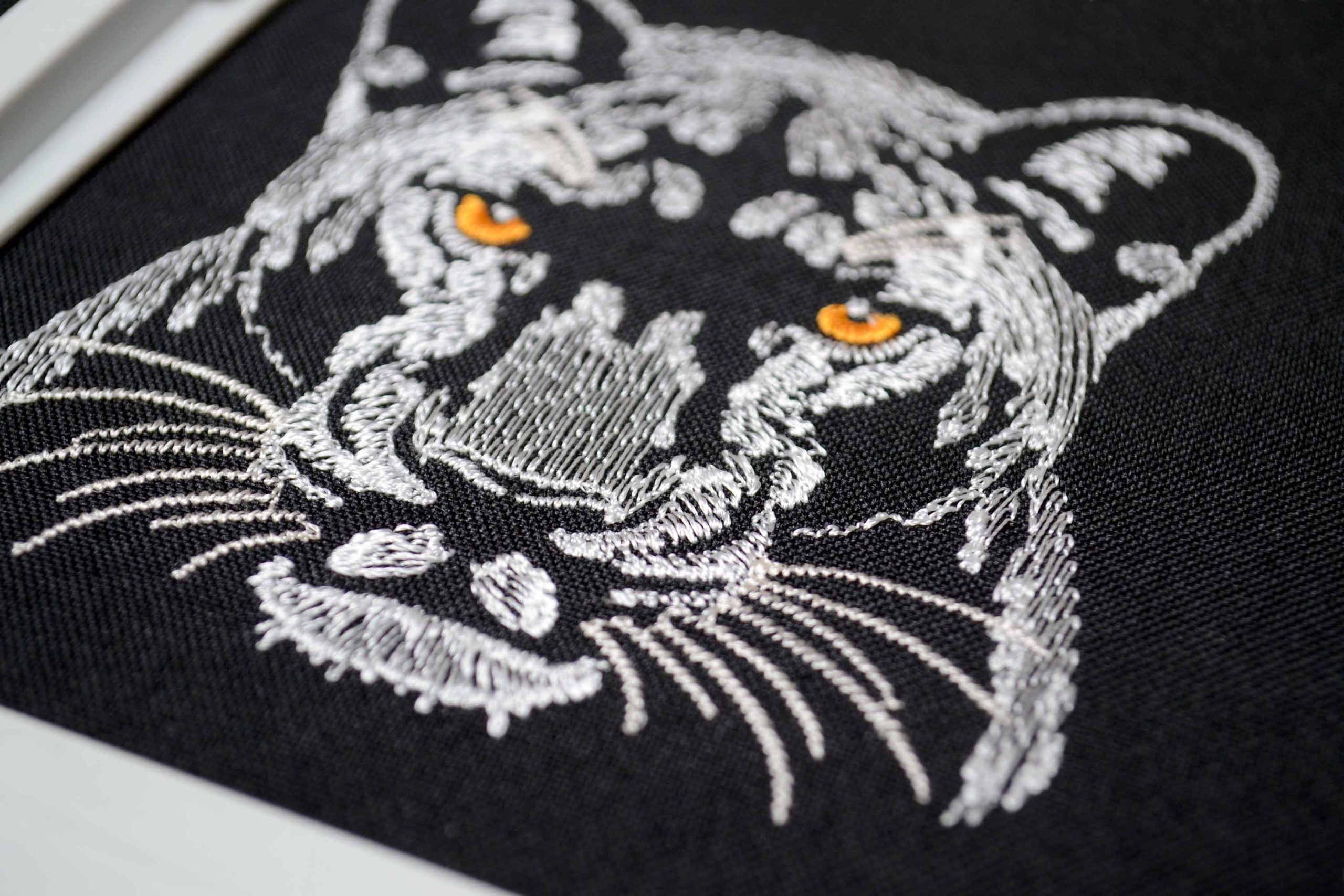 Nature inspired panther head embroidery for apparel Nature inspired panther head embroidery for apparel