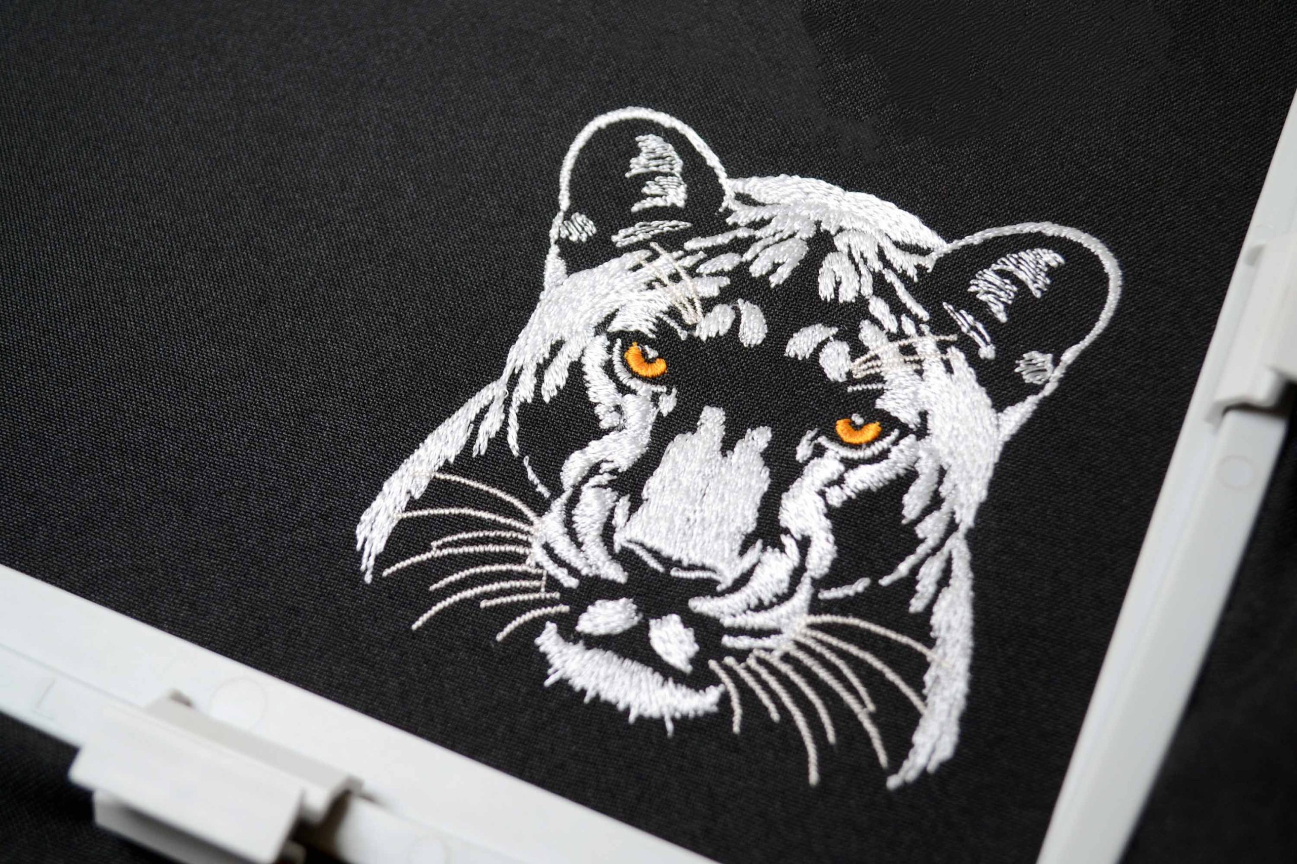 Nature inspired white panther embroidery art Nature inspired white panther embroidery art