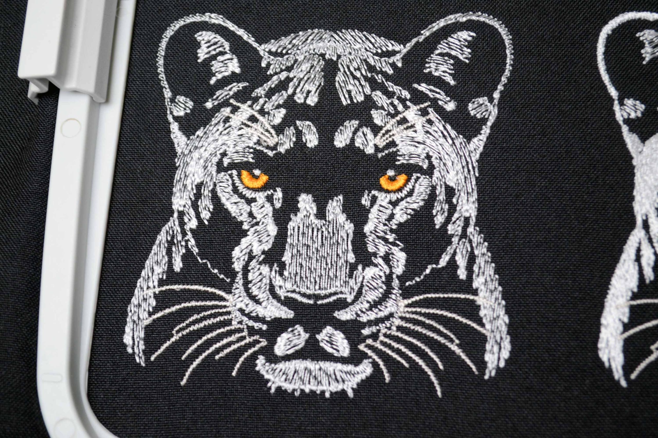 Quick stitch white panther embroidery for dark textiles Quick stitch white panther embroidery for dark textiles